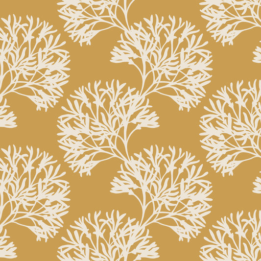 White leaf pattern on a mustard yellow background