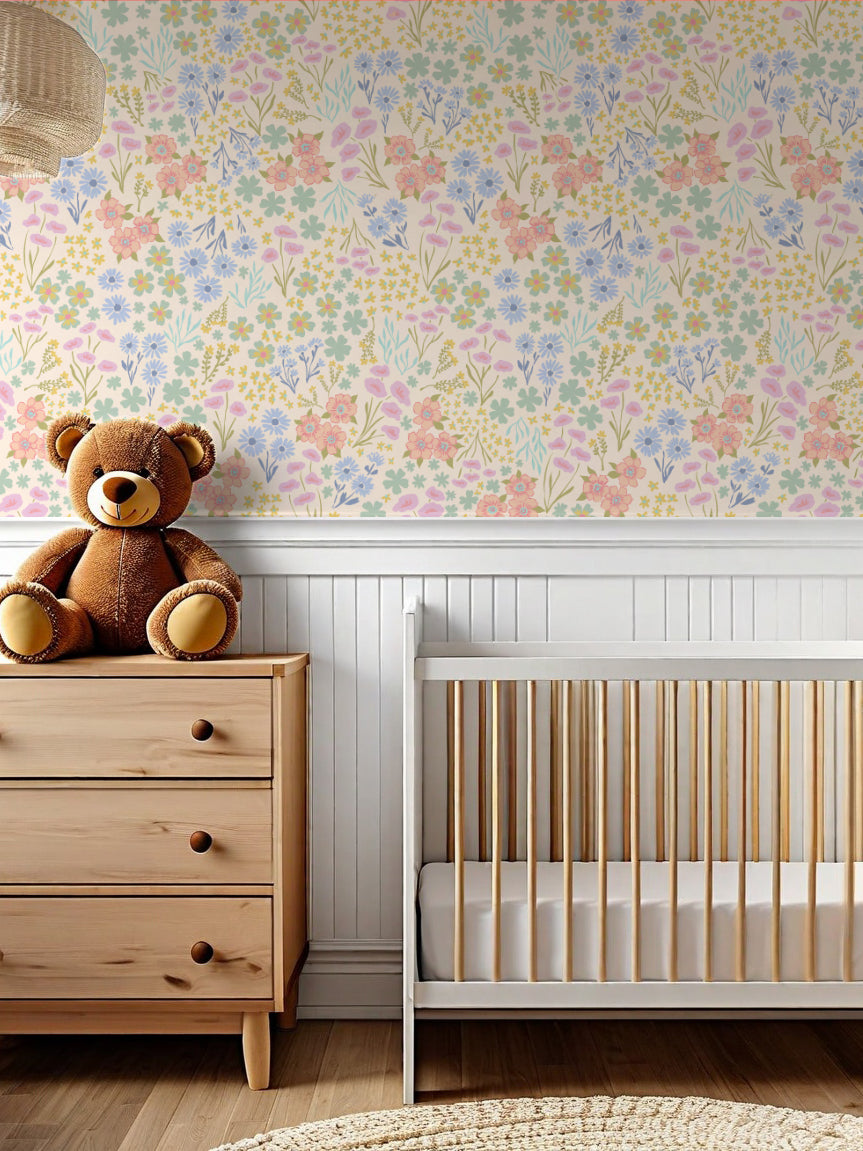 Nursery room with floral wallpaper, wooden dresser, and crib.