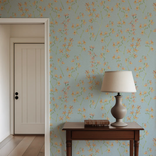 Room interior with floral wallpaper, wooden table, and lamp.