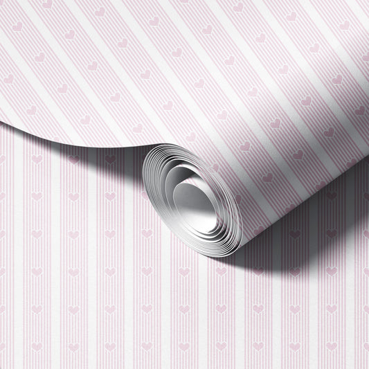 Roll of paper with pink heart pattern on a white background