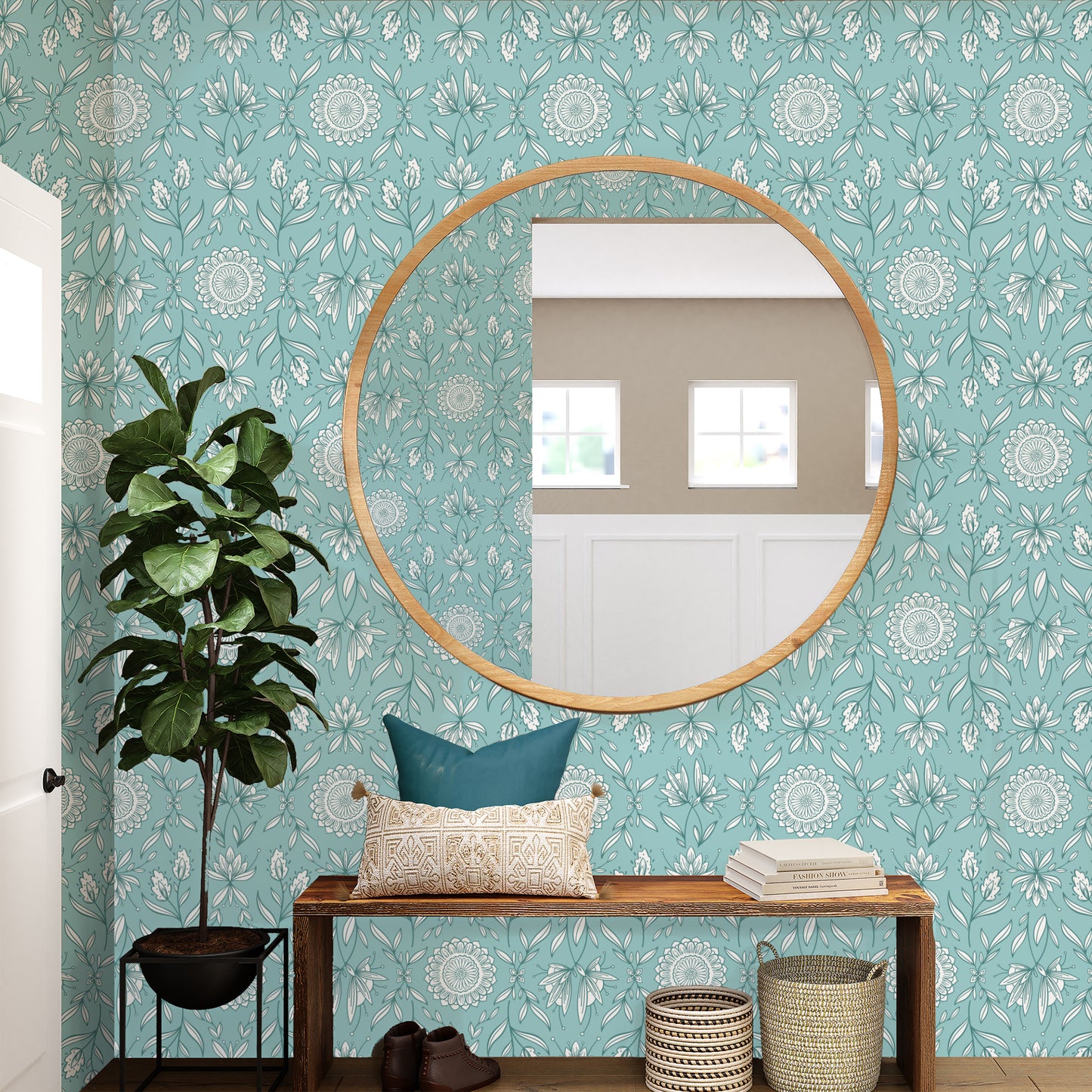 Round mirror on a wall with floral patterned wallpaper.