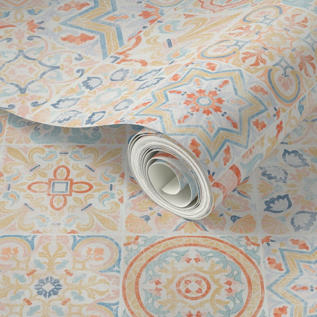 Roll of patterned wallpaper with geometric designs in pastel colors.