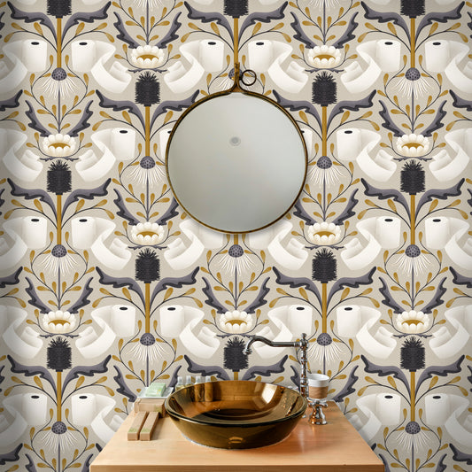 Decorative bathroom with toilet paper floral-patterned wallpaper, round mirror, and gold sink.