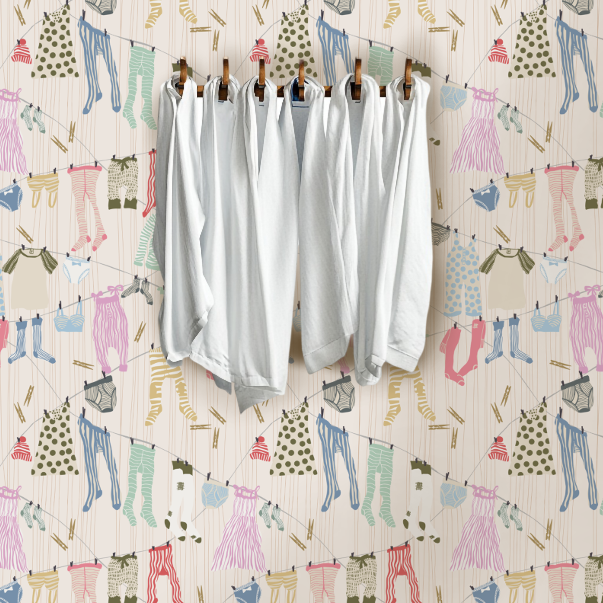 White shirts hanging with a patterned background of colorful clothing items.