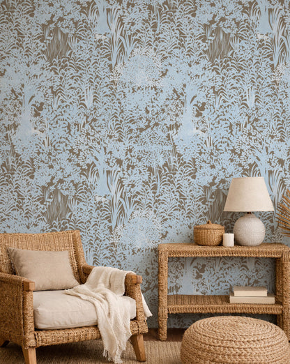 Living room with wicker furniture and patterned wallpaper