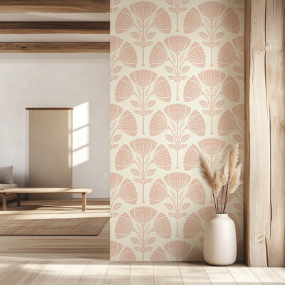 Living room with floral wallpaper, wooden floor, and white vase with dried plants.