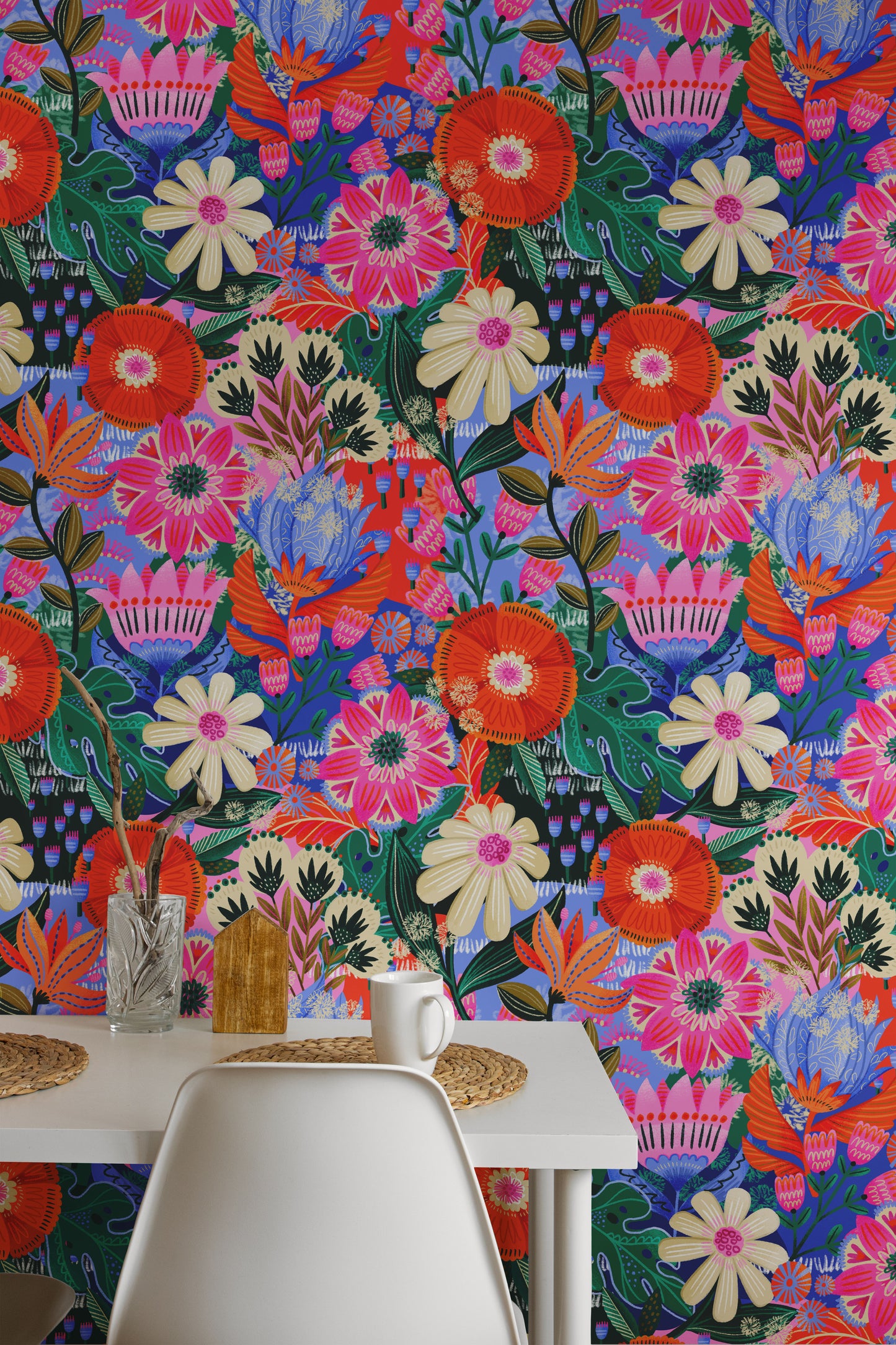 Colorful floral wallpaper with a table and chairs in the foreground
