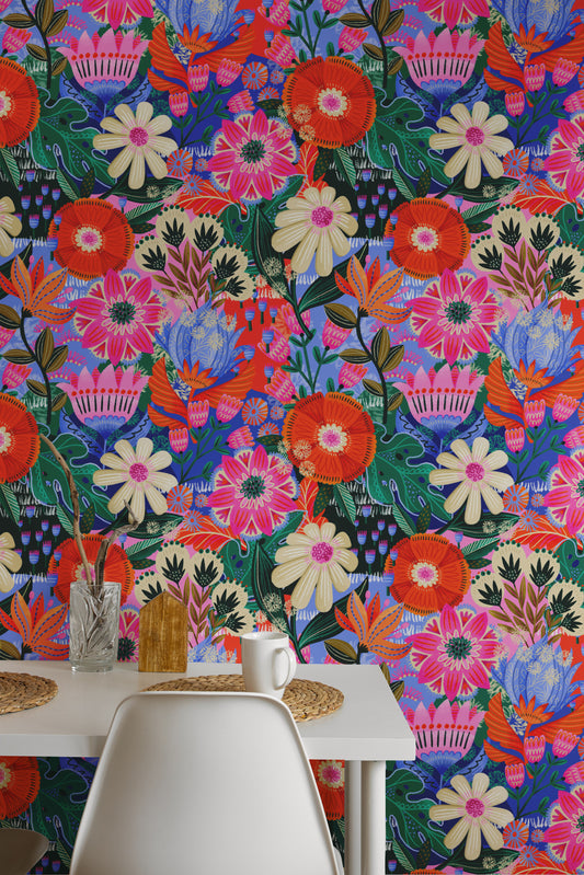 Colorful floral wallpaper with a table and chairs in the foreground