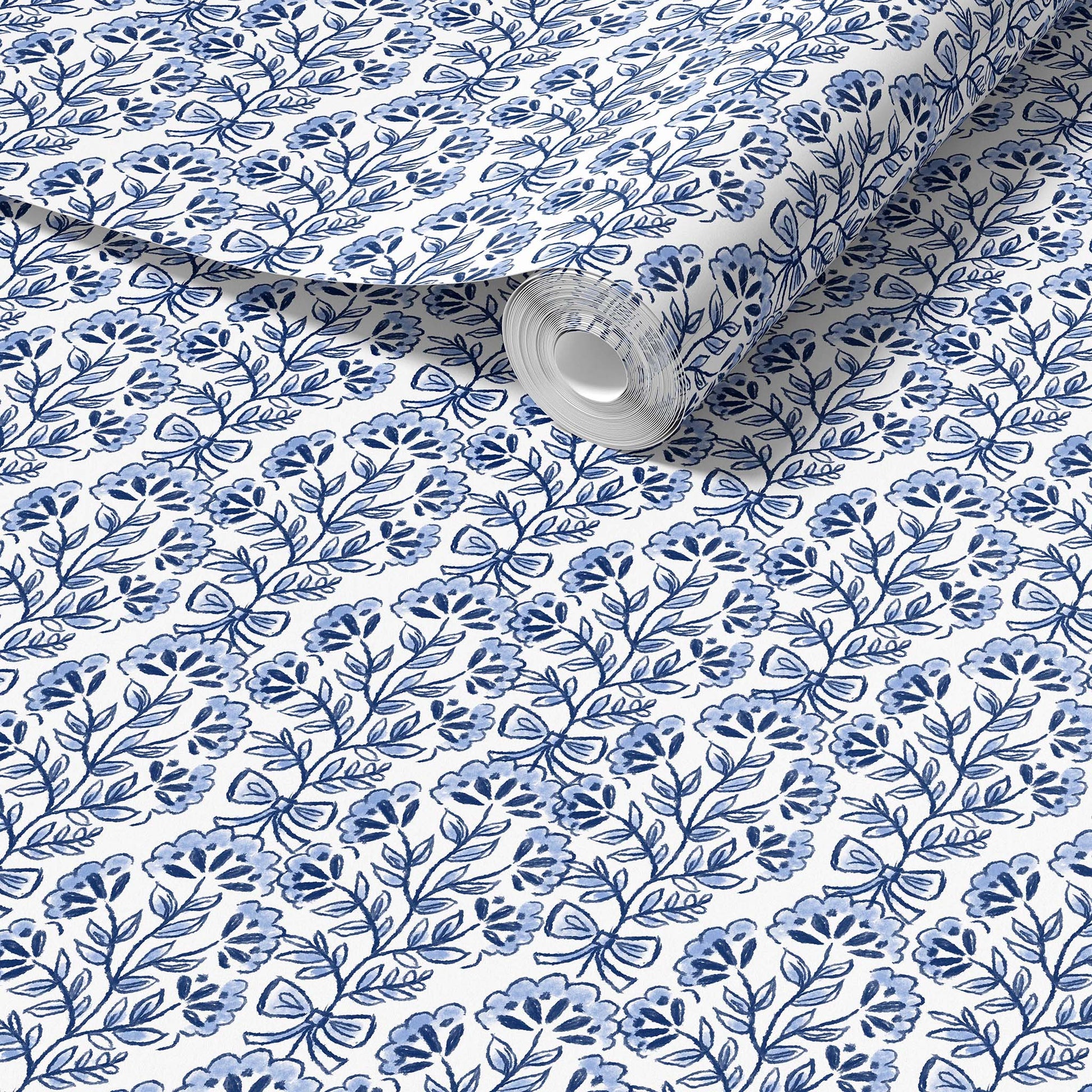 Roll of fabric with blue floral pattern on a white background