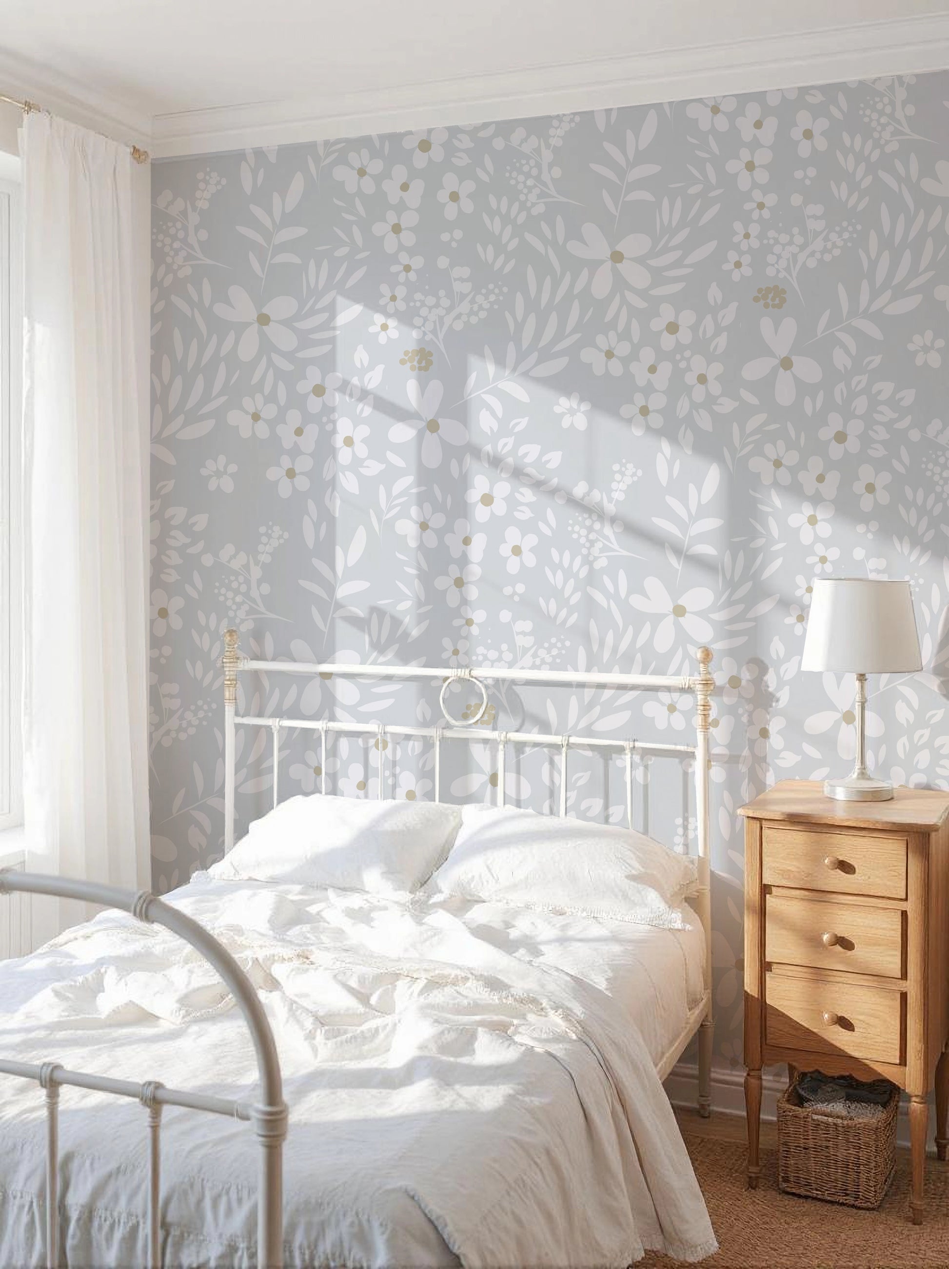 Bedroom with floral wallpaper, white bed, wooden nightstand, and lamp.