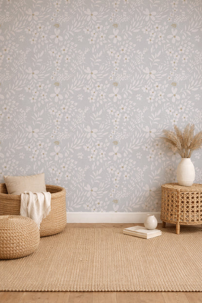 Room interior with woven furniture and decorative items against a patterned wall.