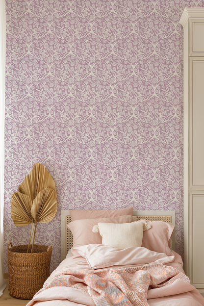 Bedroom with pink floral wallpaper, bed with pink bedding, and decorative plant.