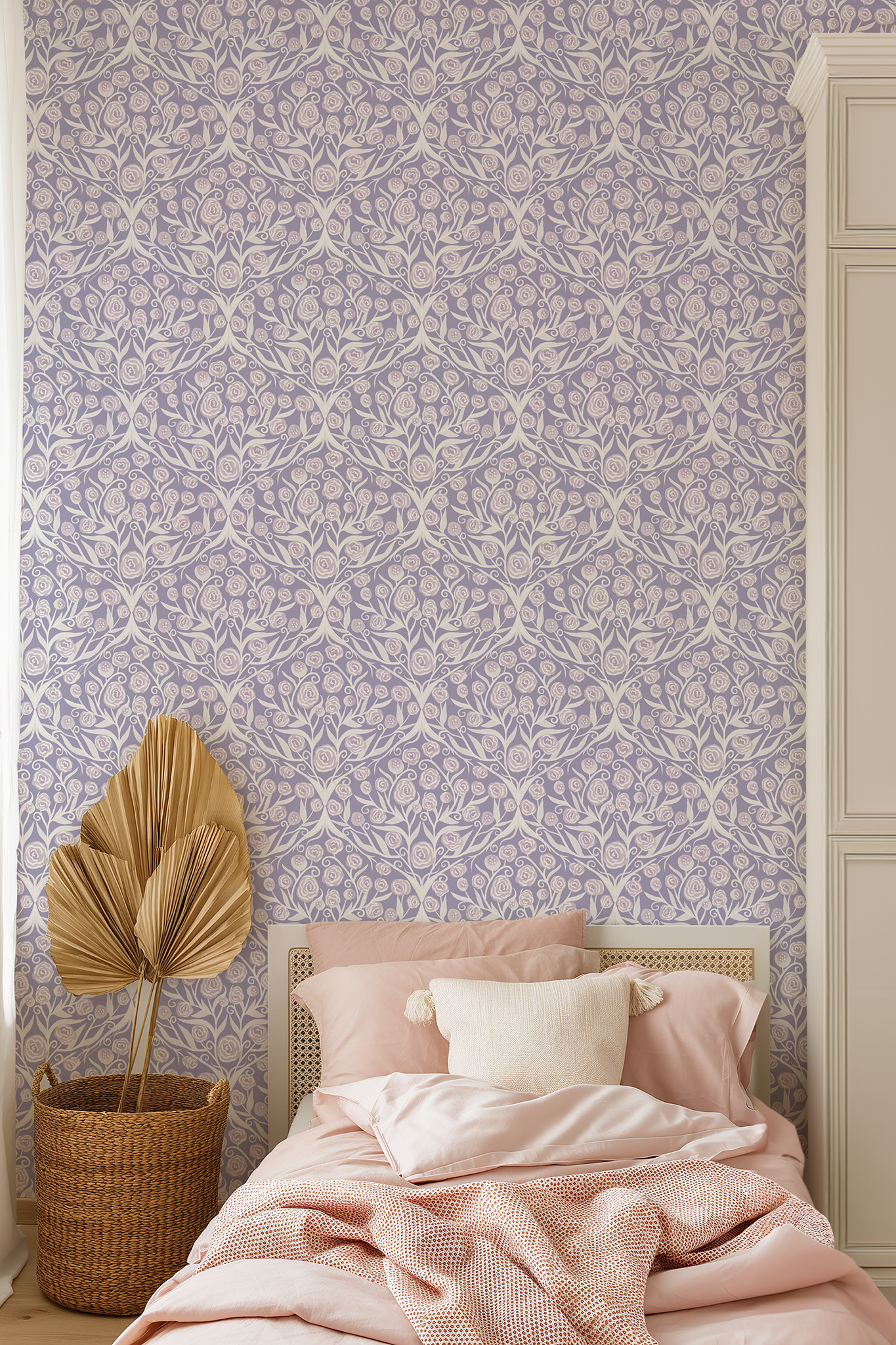 Bedroom with floral wallpaper, pink bedding, and decorative plant.
