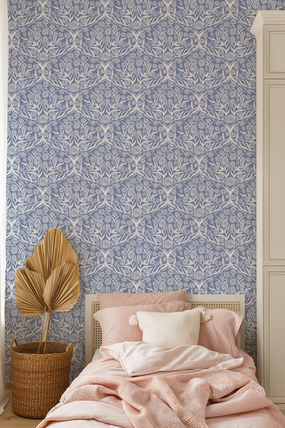 Bedroom with floral wallpaper, pink bedding, and a plant.