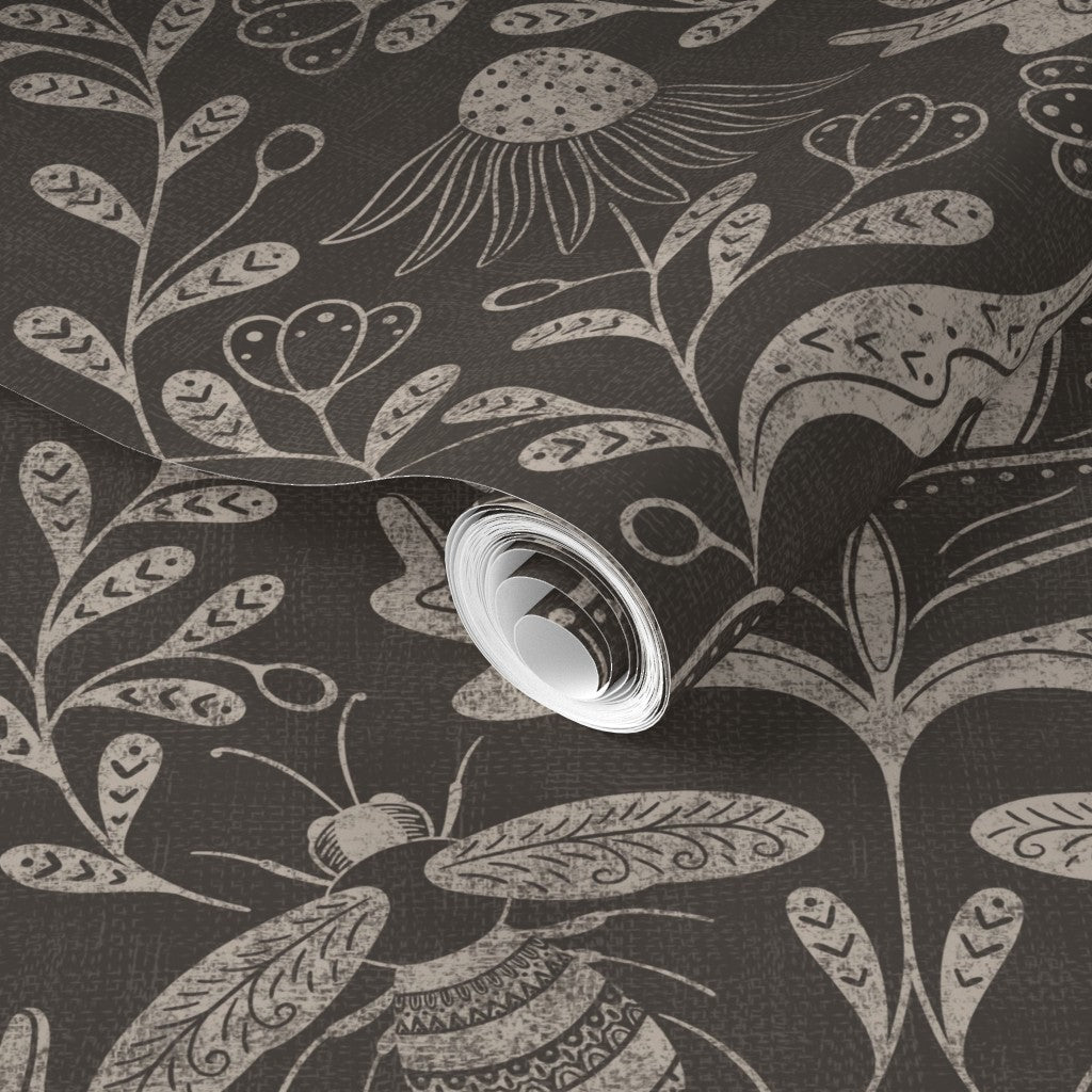 a dark background with floral and bee pattern wallpaper roll