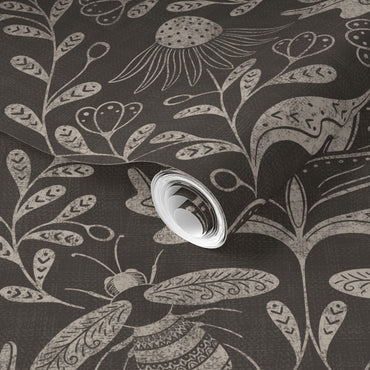 a dark background with floral and bee pattern wallpaper roll