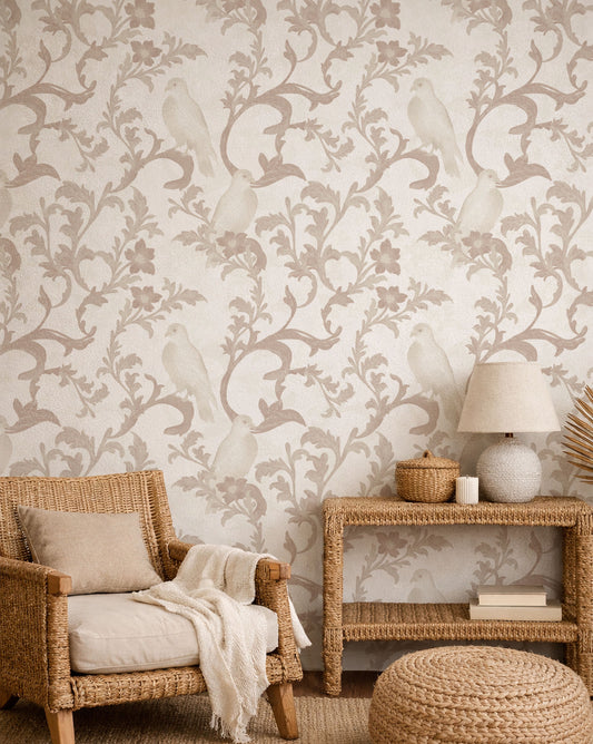 Living room with floral wallpaper, wicker chair, and side table.