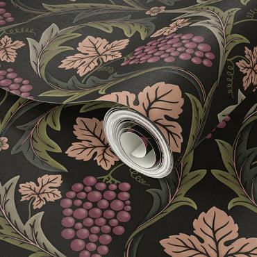 Roll of decorative paper with floral and leaf pattern on a dark background