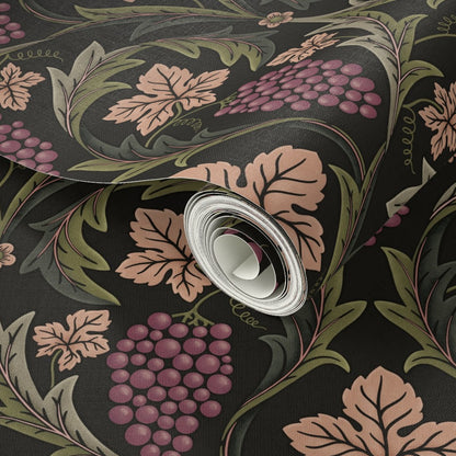 Roll of decorative paper with floral and leaf pattern on a dark background
