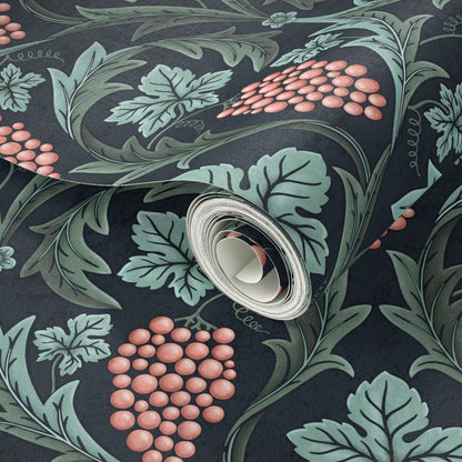 Roll of wallpaper with decorative leaf and fruit pattern on a dark background