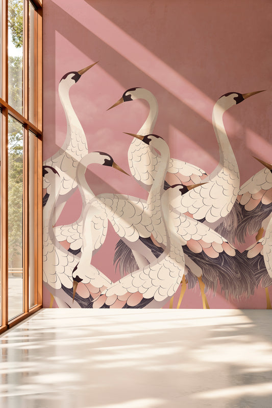 Wallpaper with crane design on a pink background in a room with a window.
