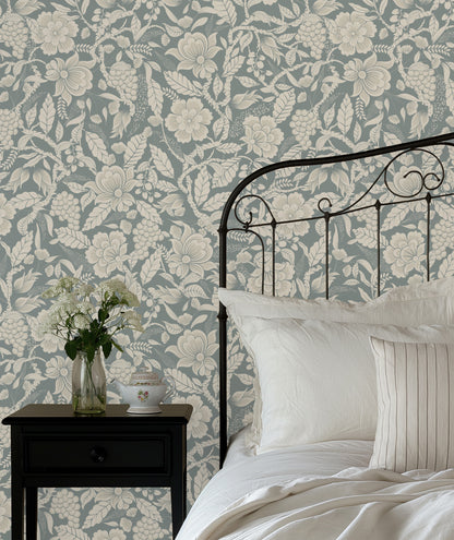 Bedroom with floral wallpaper, black metal bed frame, and white bedding.