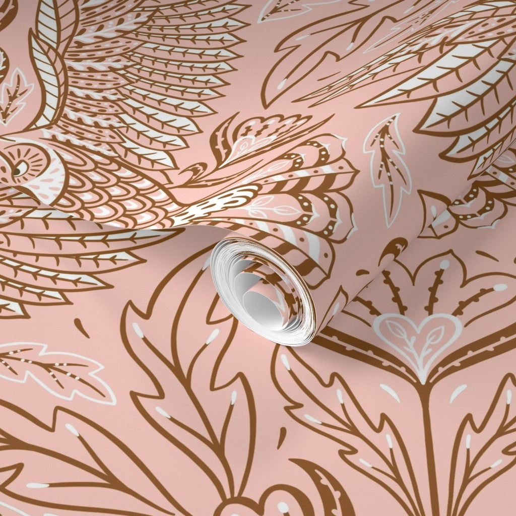 Roll of wallpaper with decorative feather pattern on a pink background