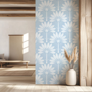 Room with a decorative wall panel featuring a palm tree pattern on a blue background.