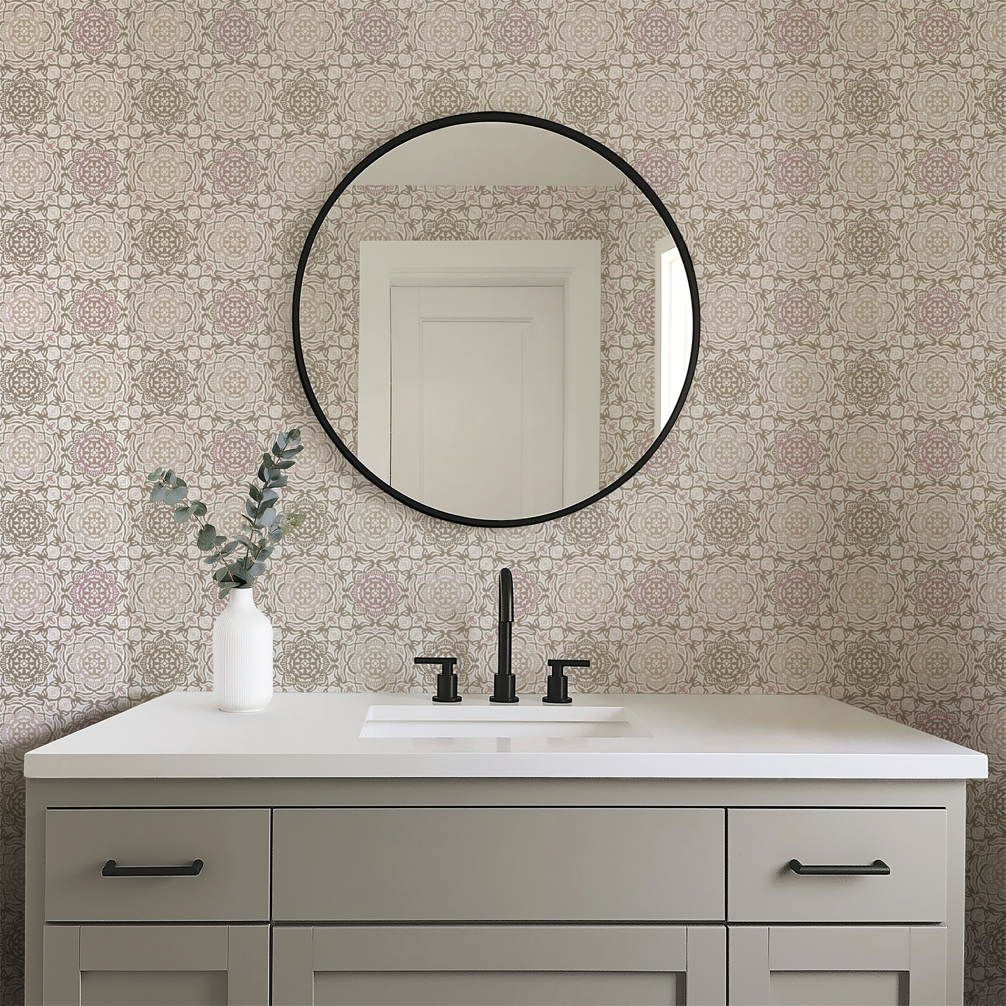 Bathroom vanity with round mirror and decorative wallpaper