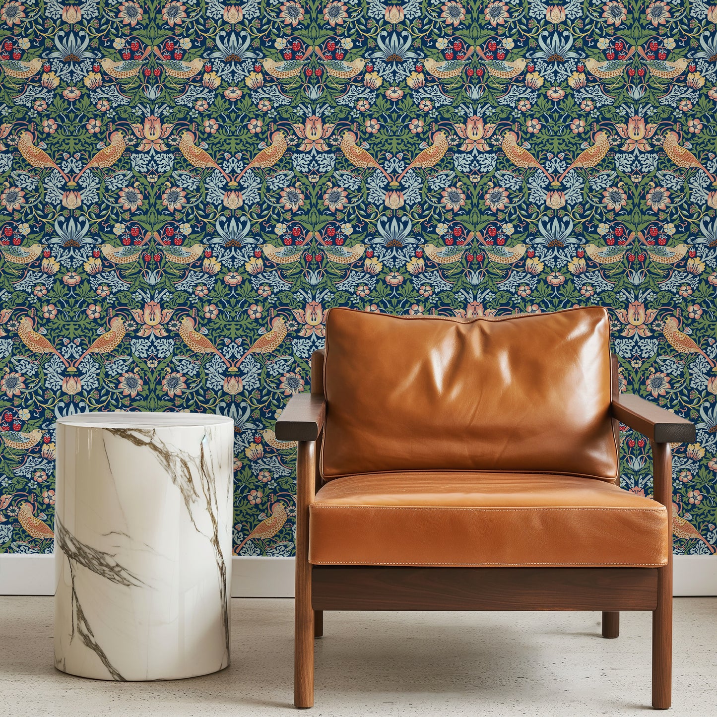 Brown leather armchair against a decorative wallpapered wall with a marble side table.