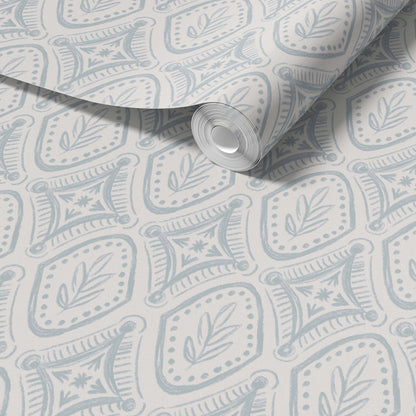 Roll of wallpaper with a subtle pattern on a light gray background