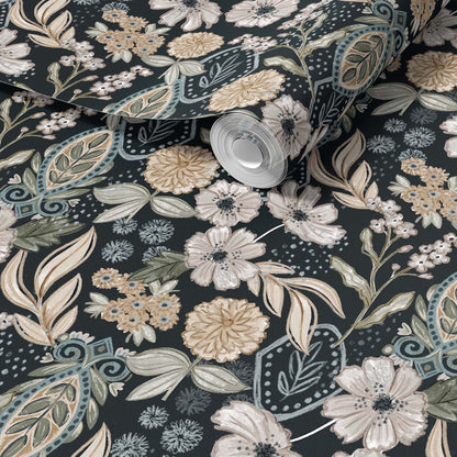 Close up of floral and leaf patterned fabric roll.