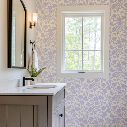 Bathroom with floral wallpaper, sink, mirror, and window.