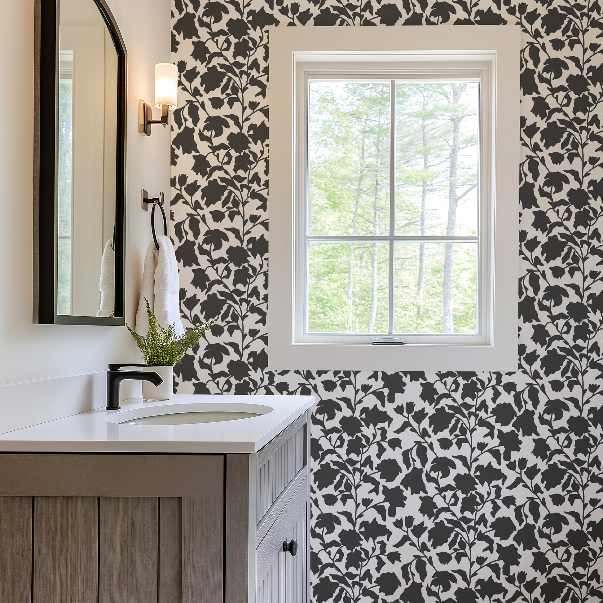 Bathroom with floral wallpaper, sink, and window