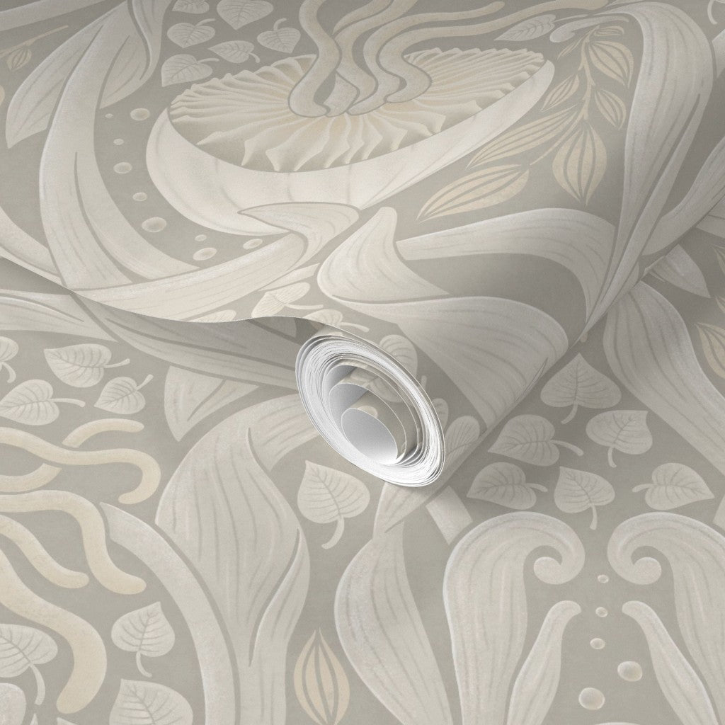 Roll of cream wallpaper with decorative pattern.