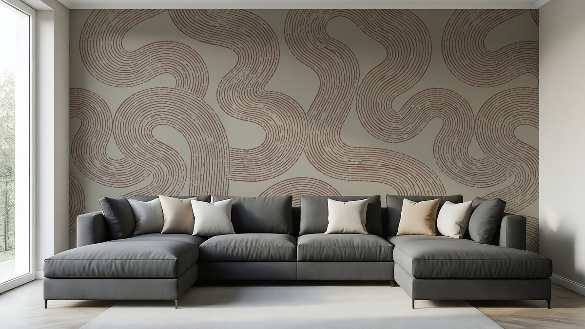 Winding Lines abstract wallpaper mural with terracotta line art in a modern living room with gray sectional sofa