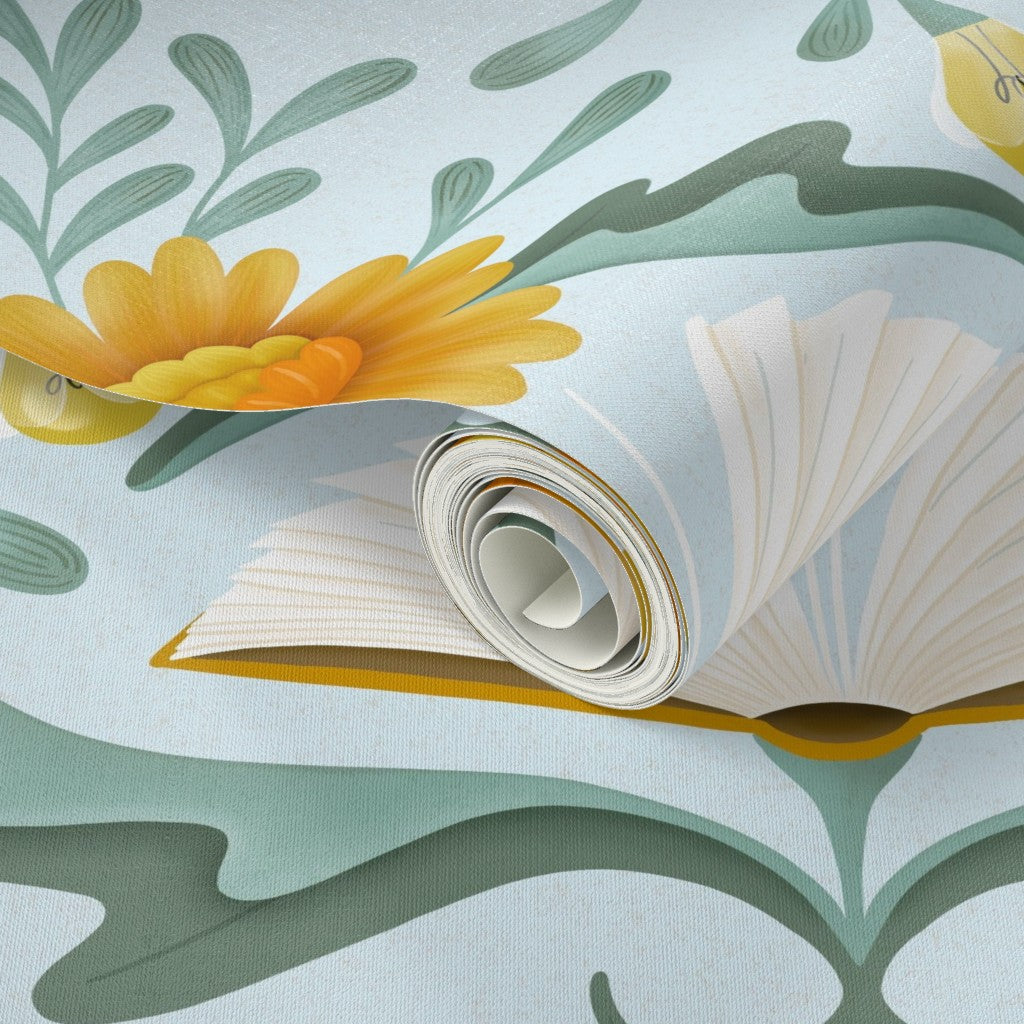 Roll of wallpaper with floral design on a light blue background