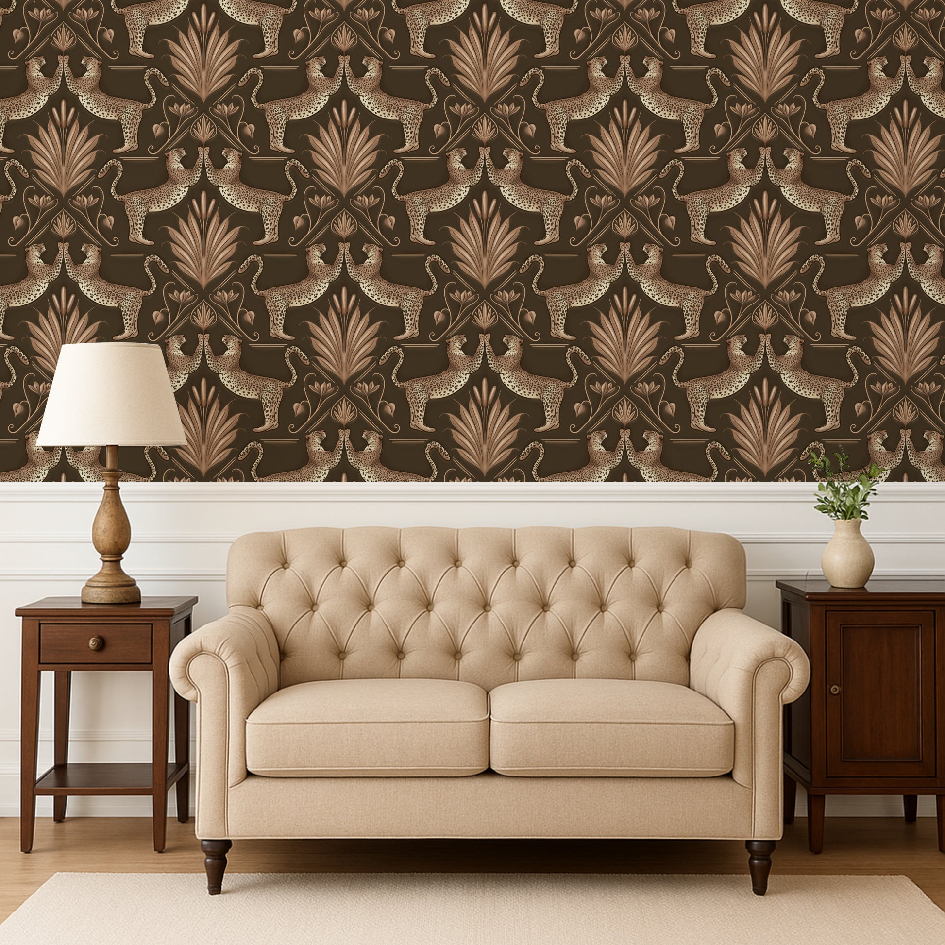 Beige tufted sofa in a room with patterned wallpaper and wooden furniture.