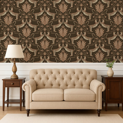 Beige tufted sofa in a room with patterned wallpaper and wooden furniture.