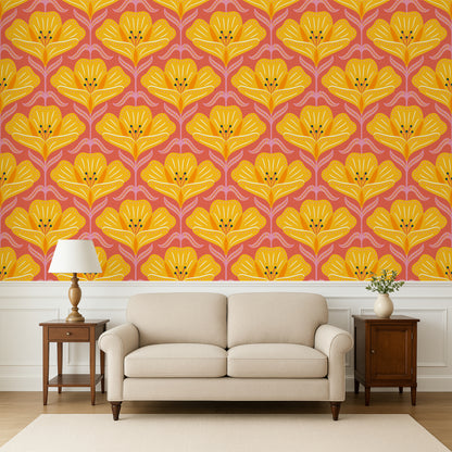 Living room with a beige sofa, wooden side tables, and a wall featuring a yellow floral pattern on a pink background.