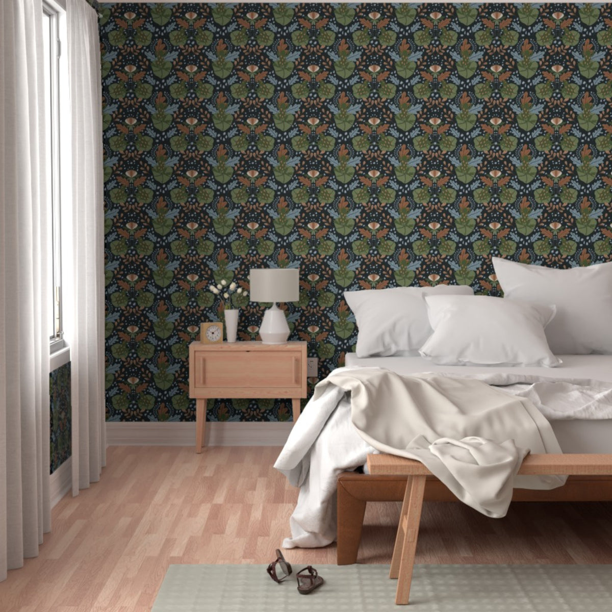Moody Woodland Botanical peel and stick wallpaper with dark woodland foliage styled in a warm modern bedroom.