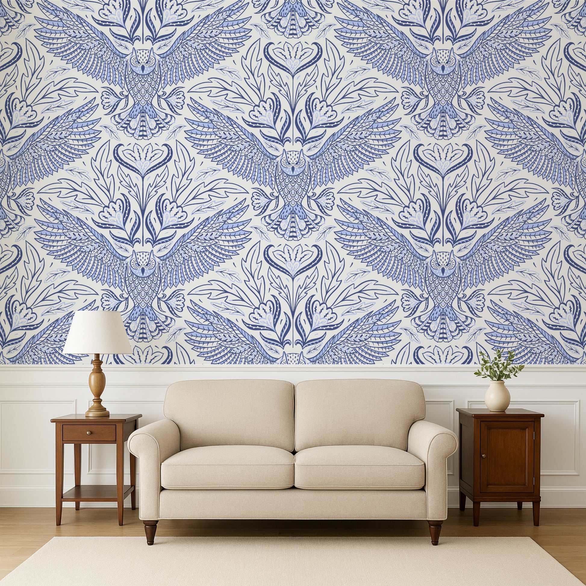 Living room with a beige sofa, wooden side tables, and a wall featuring a blue and white owl pattern.