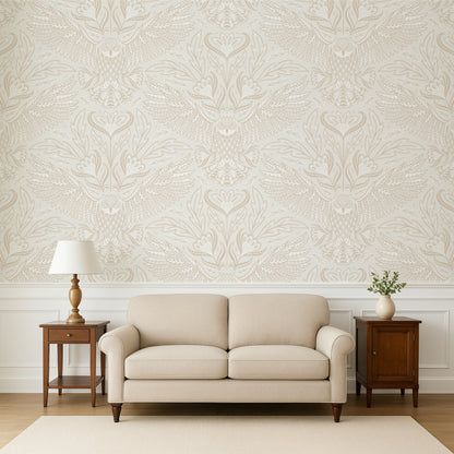 Beige sofa in a room with decorative wallpaper and wooden side tables.