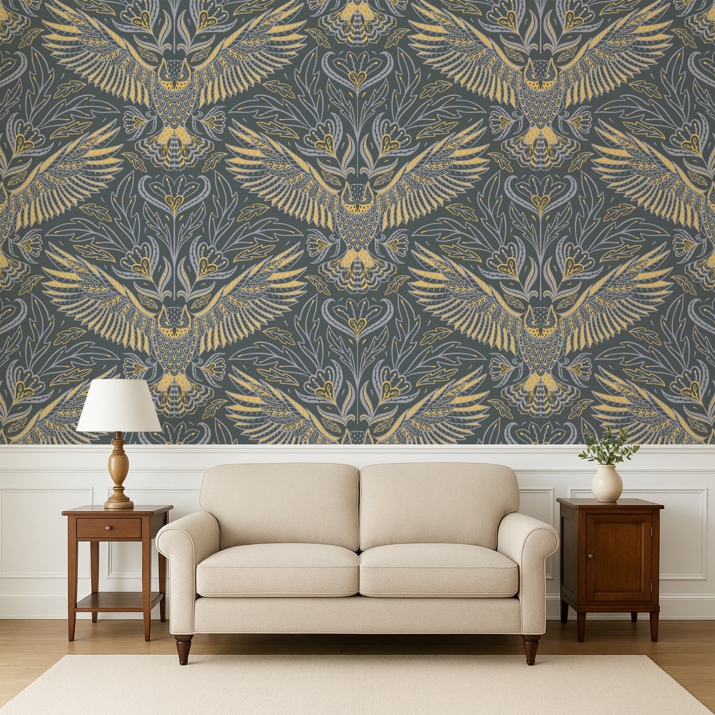 Living room with a beige sofa, wooden side tables, and a wall featuring a gold and gray patterned wallpaper.