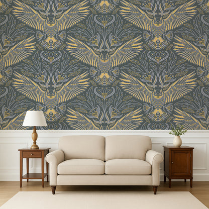 Living room with a beige sofa, wooden side tables, and a wall featuring a gold and gray patterned wallpaper.