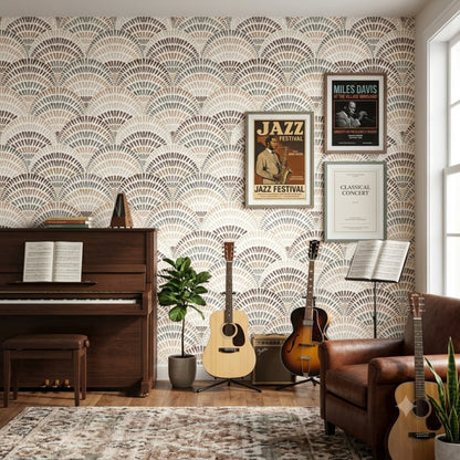 A styled room featuring wallpaper with a repeating beige, brown, and gray scallop fan pattern on the wall. The room contains a dark wood piano, acoustic guitars on stands, framed jazz and classical concert posters, a leather armchair, and a patterned area rug.