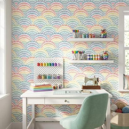Pastel rainbow arch wallpaper in a colorful kids room with playful decor.