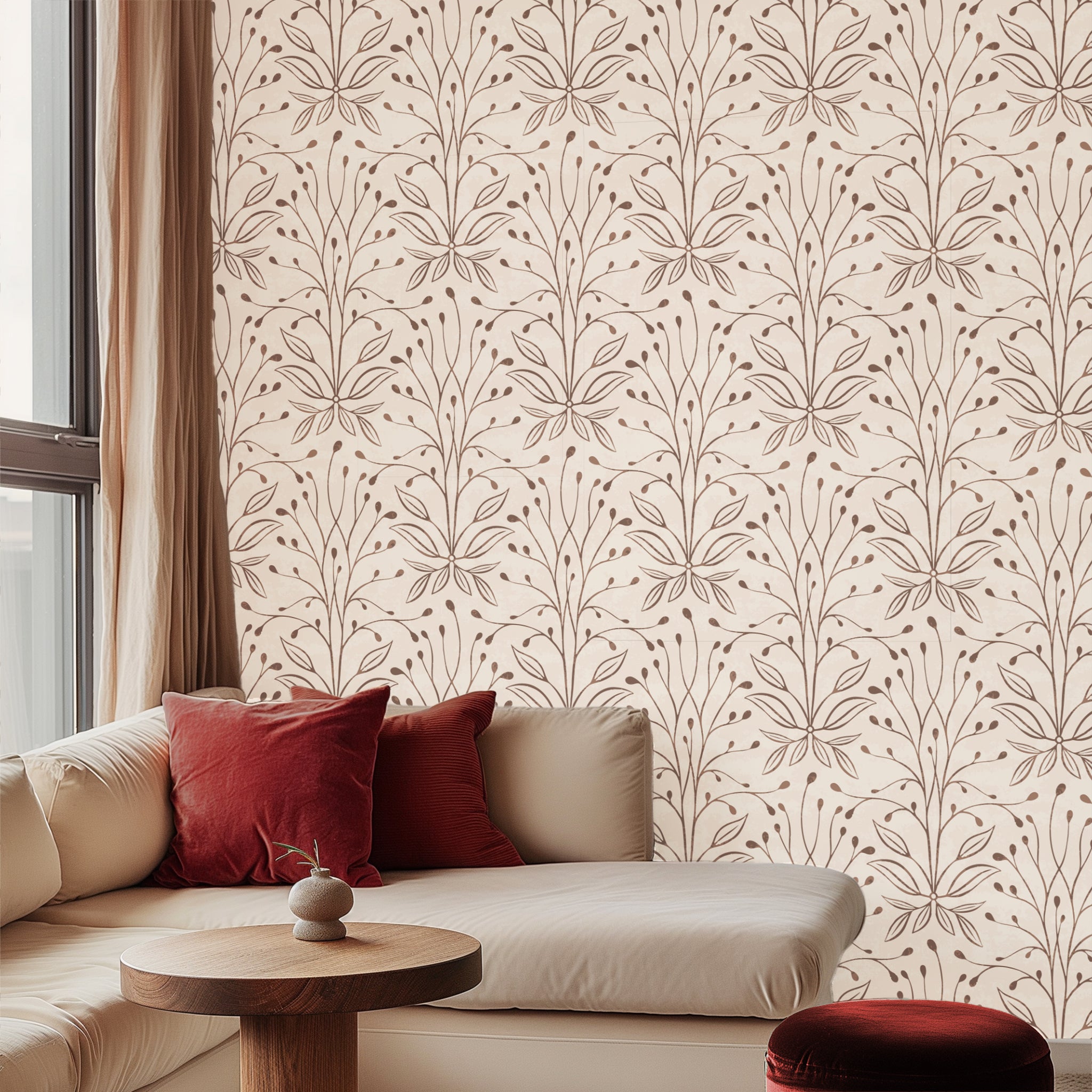 Living room with floral patterned wallpaper and red cushions on a beige sofa.