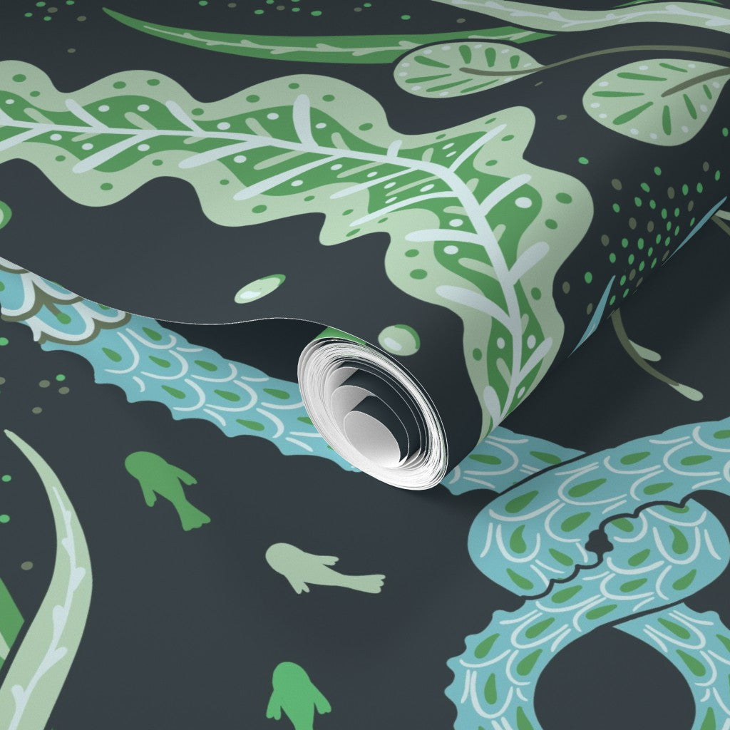 Roll of decorative wallpaper with green pattern on a dark background