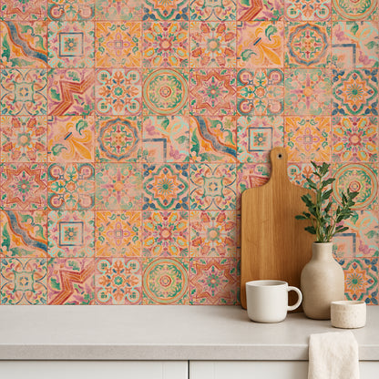 Colorful patterned tile wall with a wooden cutting board, white mug, and decorative plant.